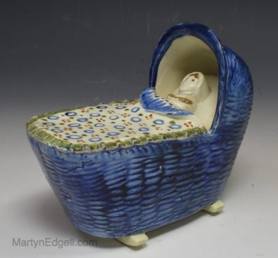 Prattware pottery toy cradle, circa 1820, probably Bovey Tracey