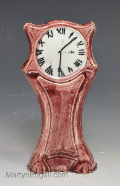Pearlware pottery figure of a long clock, circa 1820