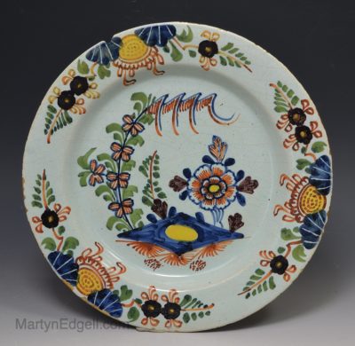 London delft polychrome plate decorated in a fried egg pattern, circa 1750