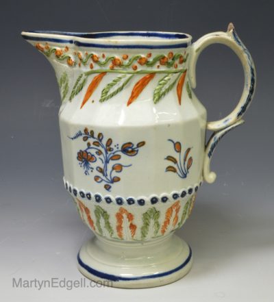 Prattware pottery jug decorated with colours under the glaze, circa 1820