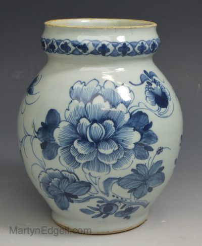 London delft jug decorated in a floral design, circa 1750