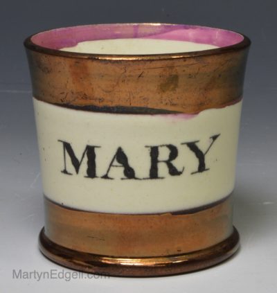 Creamware pottery child's mug 'MARY' decorated in copper lustre, circa 1840