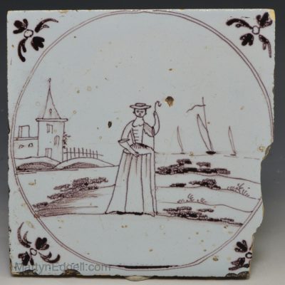 Bristol delft tile decorated with a shepherdess in manganese, circa 1750