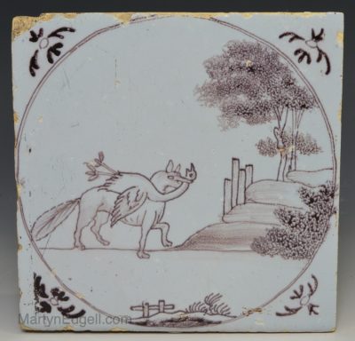 Liverpool delft tile decorated in manganese of fox with a goose in it's mouth, circa 1750