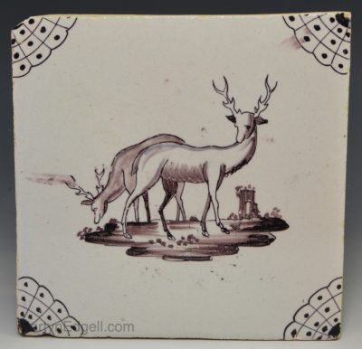 Liverpool delft tile decorated in manganese of a couple of stag's, circa 1730