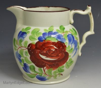 Bristol pearlware pottery jug decorated with a floral design over the glaze, circa 1820